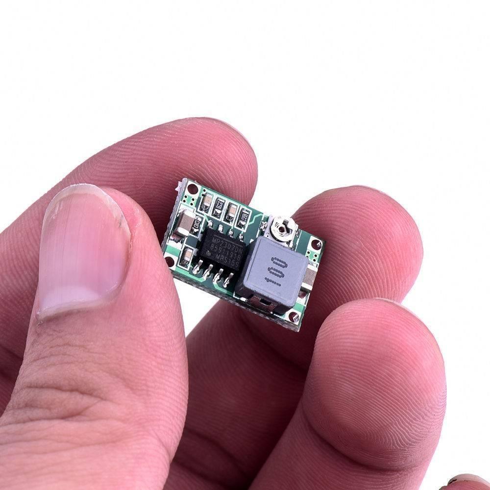 MP2307 Mini 360 DC To DC Step Down Buck Converter Module - the green circuit board, black chip, inductor, and adjustment screw.