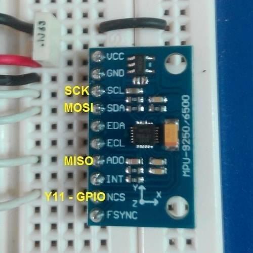MPU6500 GY-6500 6DOF 6 Axis Accelerometer Gyro Sensor - a blue rectangular circuit board with labeled pins, mounted on a white breadboard with connected wires.