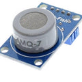 MQ7 Co Carbon Monoxide Coal Gas Sensor Module - a blue rectangular circuit board with a cylindrical grey sensor component and four metal pins at the top.