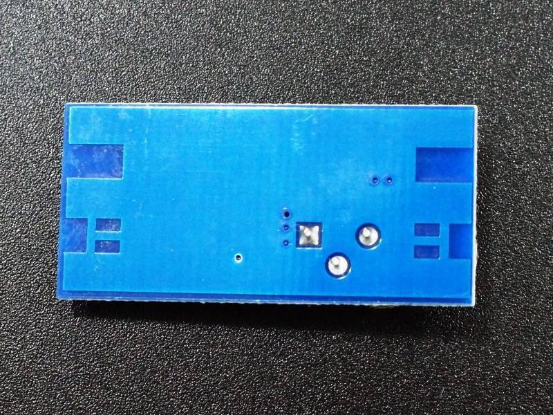 MT3608 Mini Adjustable DC-DC Boost Module - the blue rectangular underside of the circuit board with exposed soldering points and contact pads.