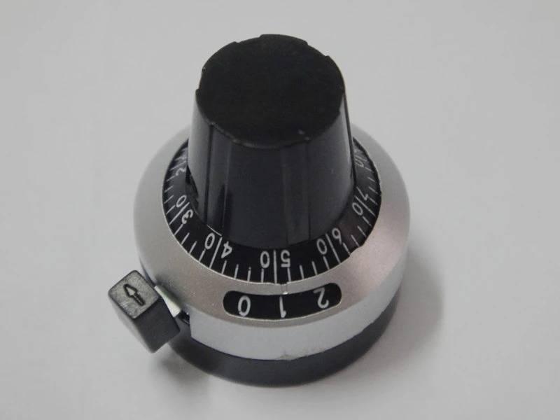 Multi-turn potentiometer knob with dial knob 3590S potentiometer knob with switch lock switch - black and silver circular dial with a locking switch and numbered markings from 0 to 9.