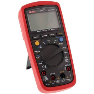 Multimeter digital UNI-T UT139C - in a red protective case, featuring a blank LCD screen, a central rotary dial, various control buttons, and input ports.