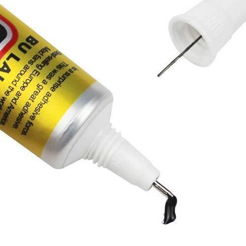 Multipurpose Adhesive Glue 50ML T7000 - shown in a close-up view with its white cap removed and a small amount of black adhesive dispensed from the nozzle.