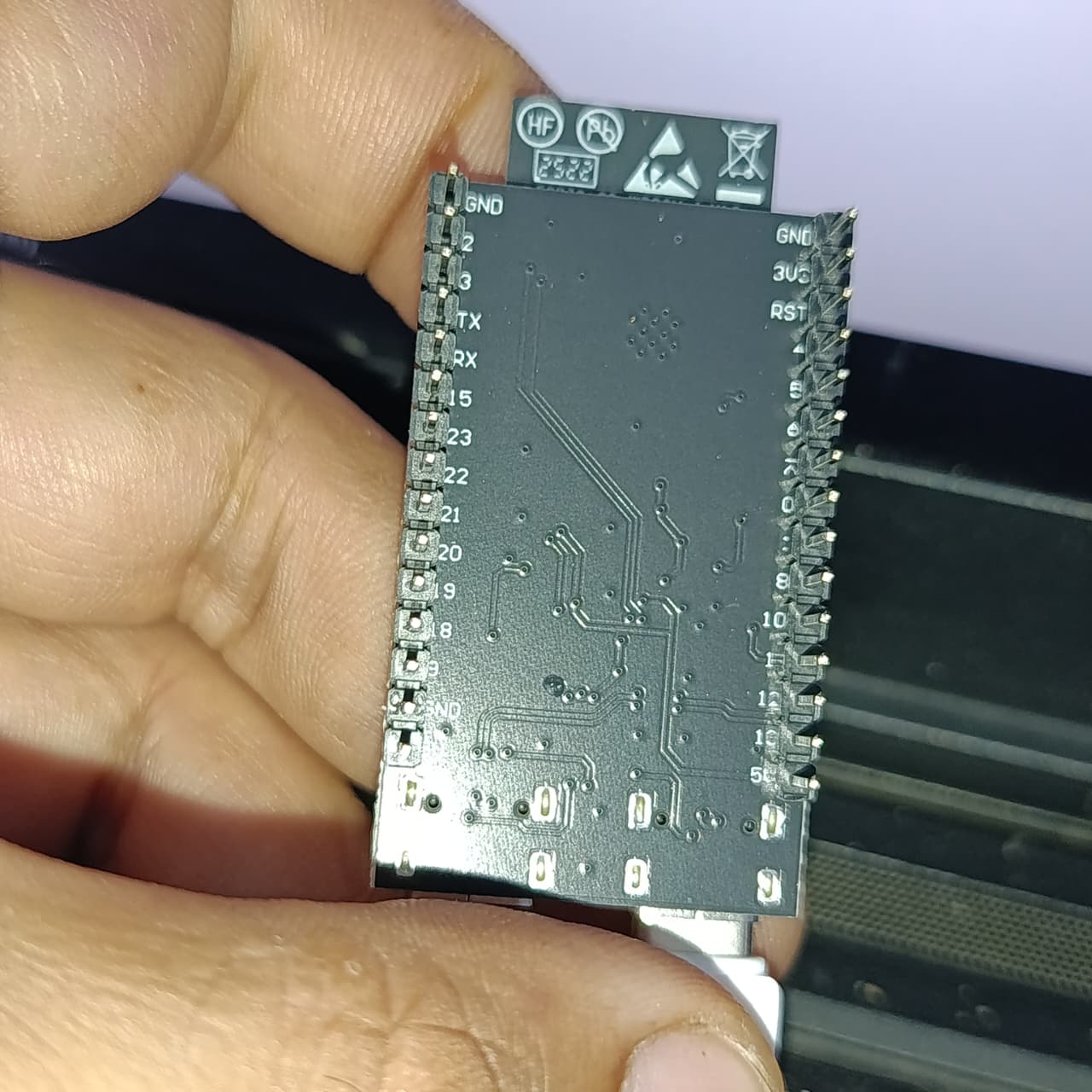 NANOESP32-C6 Development Board | ESP32-C6-WROOM-1-N4 | WiFi 6 + Zigbee + Thread | RISC-V 160MHz | 4MB Flash | Dual USB-C | RGB LED - the black underside of the PCB with pin labels, through-hole headers, and a USB-C port held by a hand.