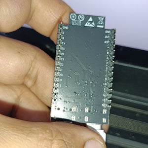 NANOESP32-C6 Development Board | ESP32-C6-WROOM-1-N4 | WiFi 6 + Zigbee + Thread | RISC-V 160MHz | 4MB Flash | Dual USB-C | RGB LED - the black underside of the PCB with pin labels, through-hole headers, and a USB-C port held by a hand.