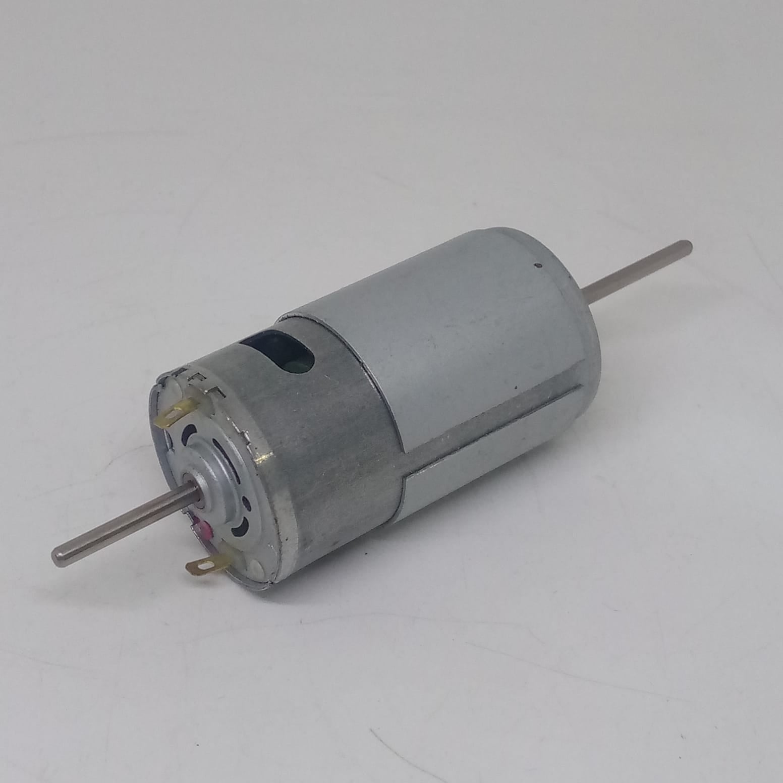 Narrow Shaft Motor 3.17mm Shaft 12V Charger Fans DC Motor - a silver cylindrical motor with a long metal shaft extending from both ends.