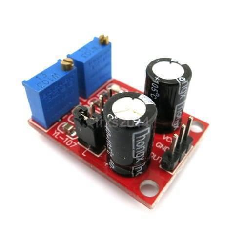 NE555 Pulse Frequency Duty Cycle Adjustable Module Square Wave Signal Generator - a red circuit board with two blue potentiometers, two black electrolytic capacitors, and pins.