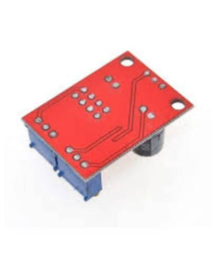 NE555 Pulse Frequency Duty Cycle Adjustable Module Square Wave Signal Generator - shown from a top-down angle, featuring a red PCB with two blue potentiometers and a black capacitor.