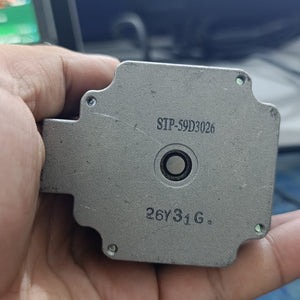 NEMA 23 Stepper Motor In Pakistan (1.5A–2.0A, 1.8°) - a close-up of the silver metal face showing the centered shaft hole and the printed text STP-59D3026 and 26Y31G.