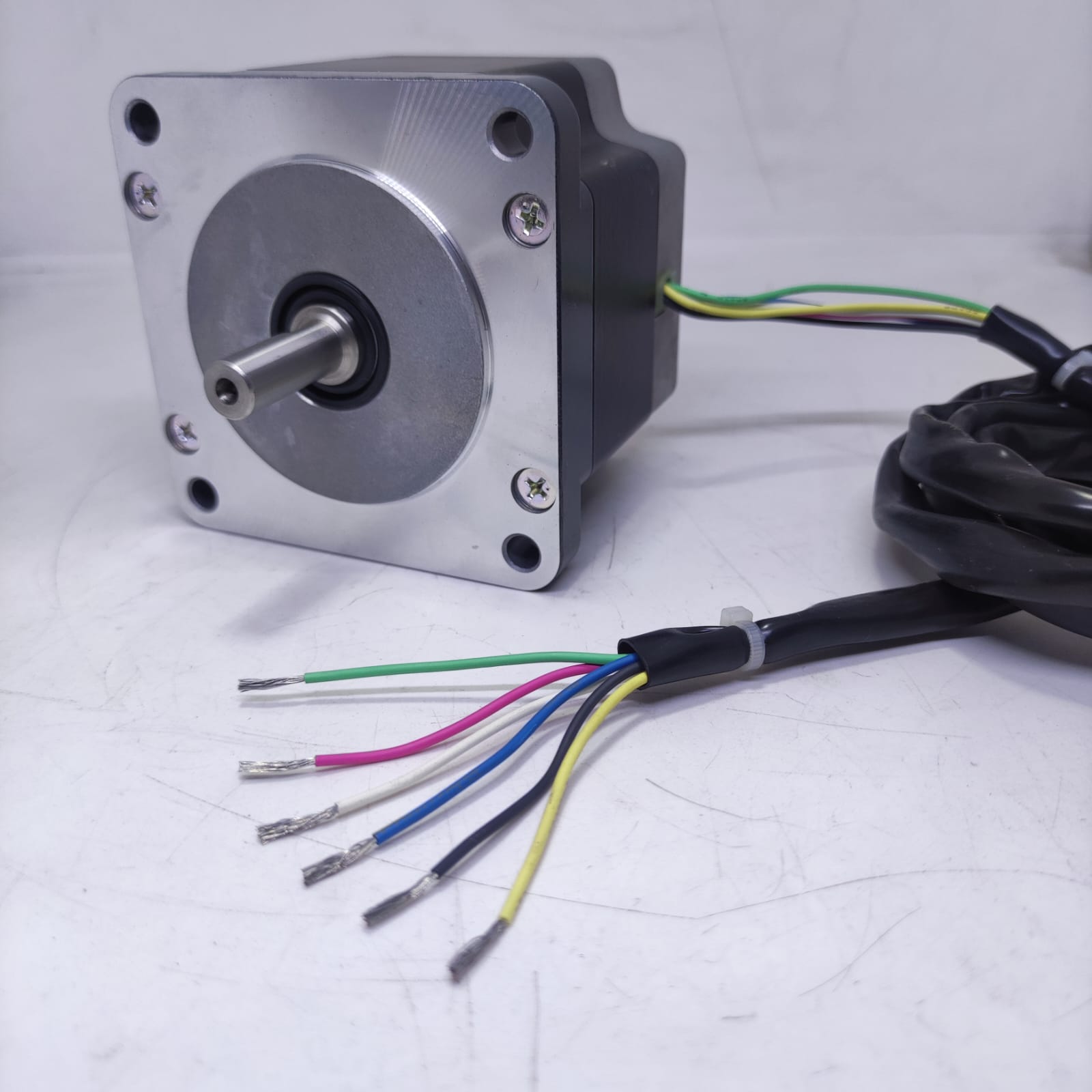 NEMA 34 Stepper Motor PK296-02A-A4 | Made In Japan | Digilog.pk - a silver and black square-bodied motor with a front shaft and a bundle of six multi-coloured wires.