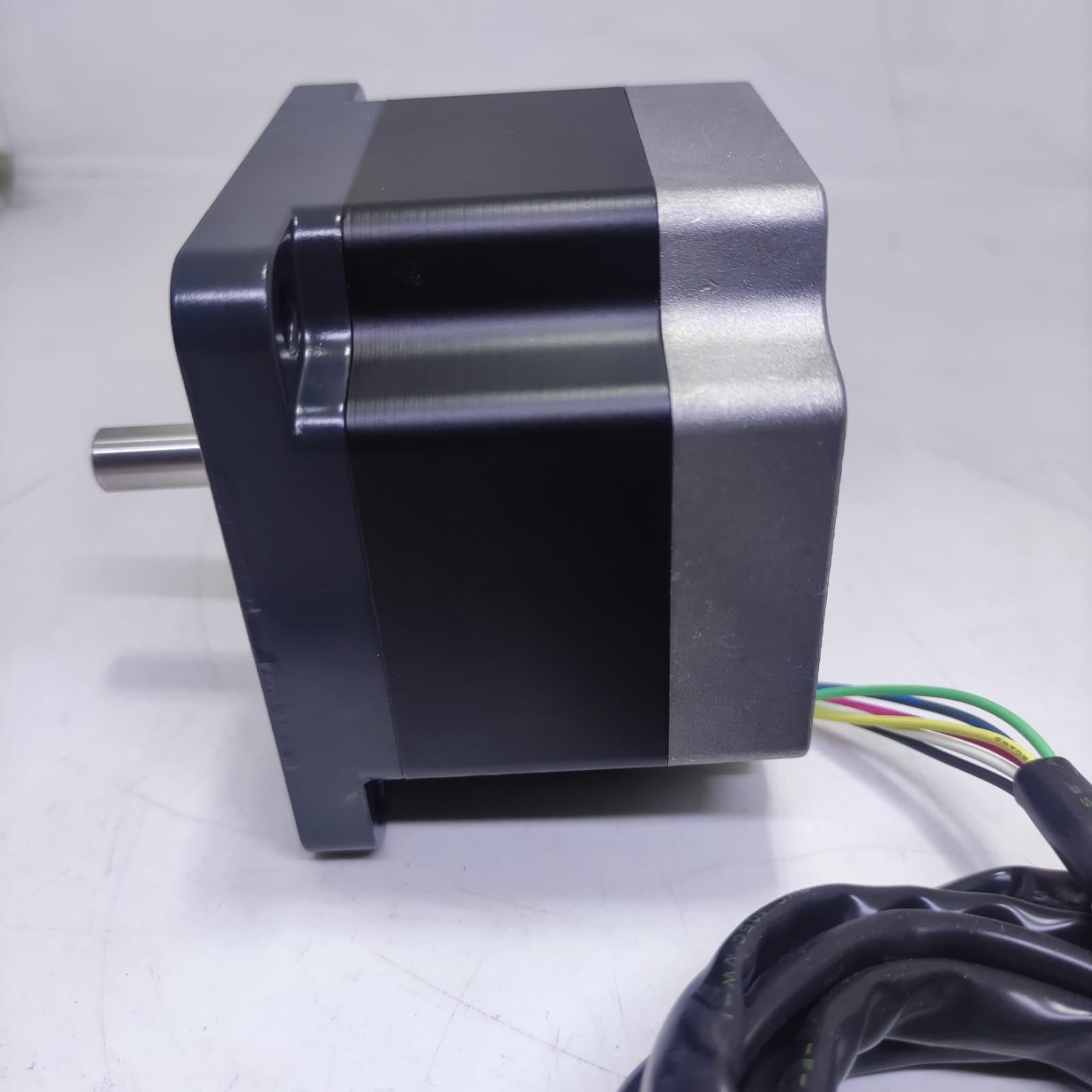 NEMA 34 Stepper Motor PK296-02A-A4 | Made In Japan | Digilog.pk - a black and silver motor with a protruding metal shaft and a multi-colored wire harness extending from the rear.