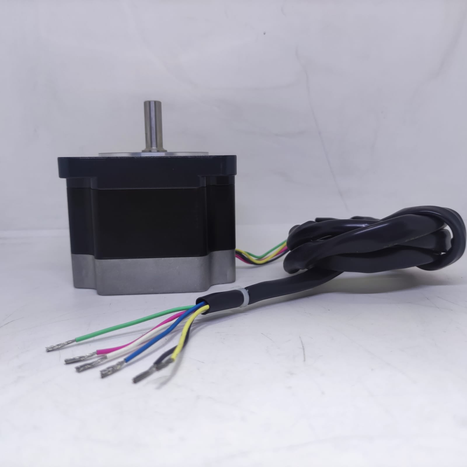 NEMA 34 Stepper Motor PK296-02A-A4 | Made In Japan | Digilog.pk - a black and silver motor with a metal shaft and a multi-coloured wire harness extending from the side.