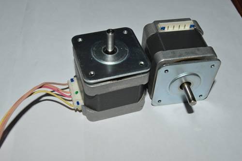 NEMA17 NEMA 17 Stepper Motor For 3D Printer And CNC - two square silver and black motors with central rotating shafts and white electrical connector ports with attached wires.