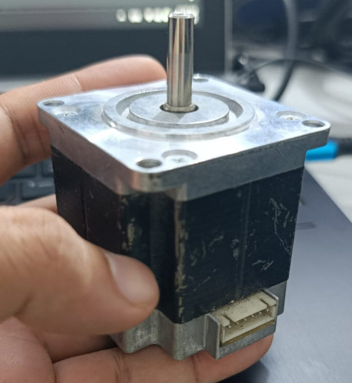 NEMA23 Bipolar 1.8 Degree 2.1A 54mm Stepper Motor 6.35mm Shaft Torque 15kg/cm Refurnished - shown in a hand, featuring a black square body, a silver metal shaft, and a white multi-pin connector port at the base.