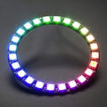NeoPixel Ring 24bit WS2812 5050 RGB LED - Full Color Programmable Light - a circular circuit board with 24 individual LEDs illuminated in a multi-colored gradient against a dark background.