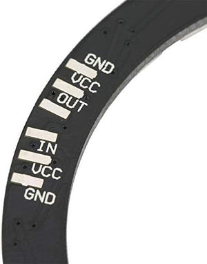 NeoPixel Ring 24bit WS2812 5050 RGB LED - Full Color Programmable Light - a close-up of a black circular circuit board showing clearly labeled GND, VCC, OUT, and IN connection points.