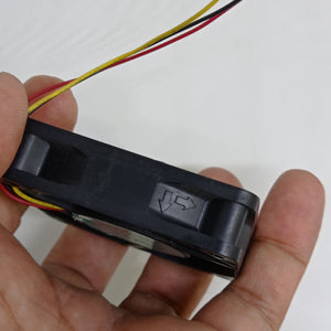 NEW 24V 60mm x 60mm x 15mm Brushless DC Cooling Fan - a close-up of the black fan housing showing the airflow direction arrows molded into the side.