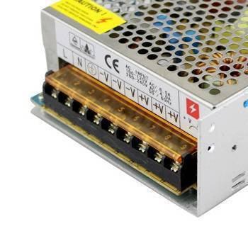 New 5V 40A 200W Switching Power Supply SMPS - a silver metal casing with a perforated top and a terminal block with screw connectors on the side.