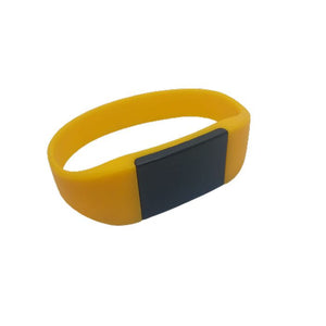 NFC IC 125kHz Bracelet RFID - a yellow silicone wristband featuring a solid black rectangular RFID tag module.