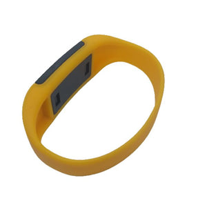 NFC IC 125kHz Bracelet RFID - a yellow silicone wristband featuring a rectangular dark grey electronic module with two small rectangular indentations.