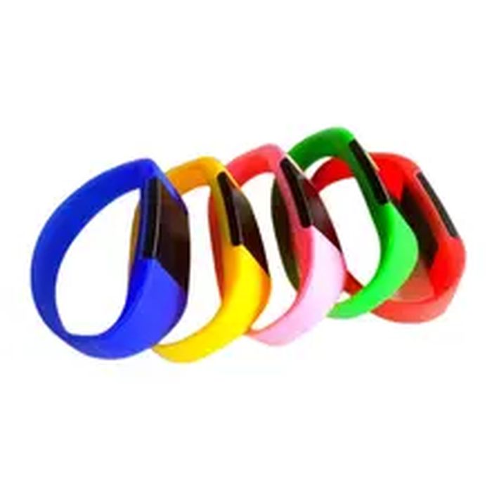 NFC IC 125kHz Bracelet RFID - five silicone wristbands in blue, yellow, pink, green, and red, each featuring a black rectangular central module.