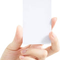 NFC Tag 13.56MHz RFID Card RFID Tag 1k Memory - Blank white NFC card held between finger and thumb, shown plain with no printing on its face.