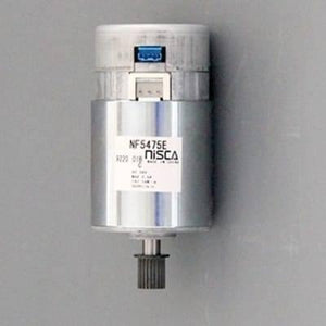 Nisca Servo DC Motor With Encoder NF5475E DC 24V To 38V And 3500 To 5000RPM - a cylindrical silver motor with a black gear on the shaft, a top connector port, and a label showing model specifications.
