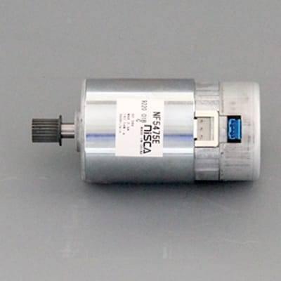 Nisca Servo DC Motor With Encoder NF5475E DC 24V To 38V And 3500 To 5000RPM - a silver cylindrical motor with a black gear on the shaft, a white label, and a blue connector on the rear end.