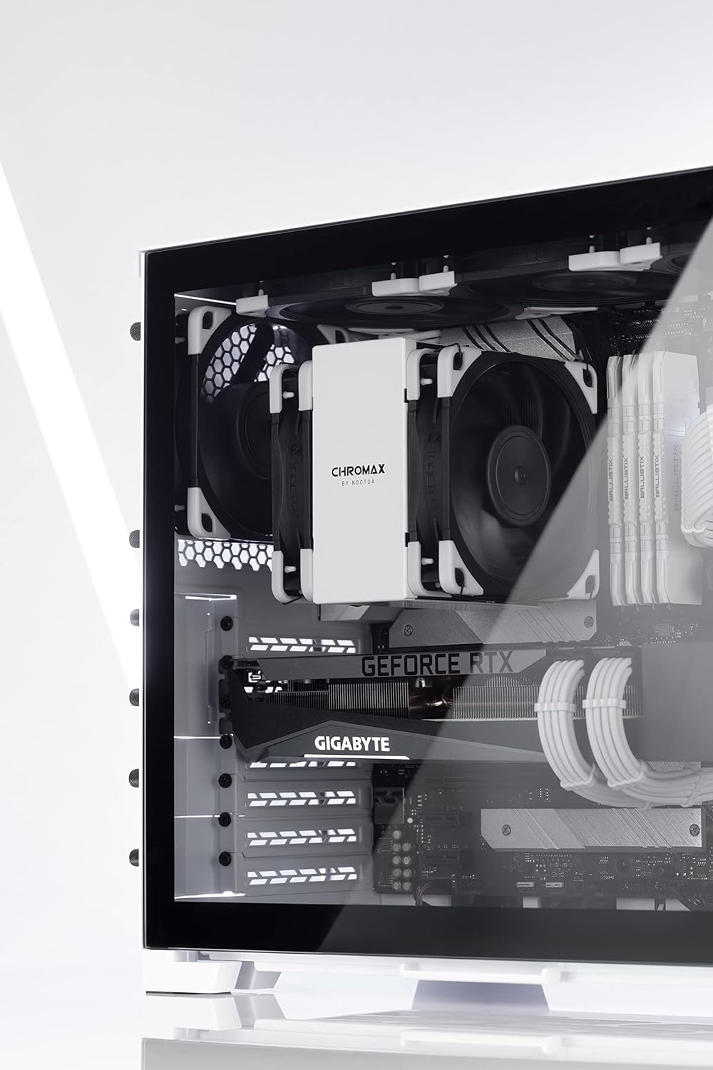 Noctua NA-SAVP1 chromax.White, Anti-Vibration Pads - installed on a black Noctua CPU cooler fan inside a white computer case.