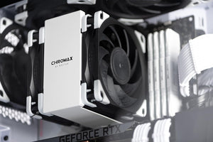 Noctua NA-SAVP1 chromax.White, Anti-Vibration Pads - installed on the corners of a black Noctua CPU cooling fan mounted on a white heatsink inside a PC case.