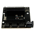 NodeMcu Sensor Shield GPIO Board - a black rectangular expansion board featuring two rows of pin headers, a DC power jack, and labeled GND pins.