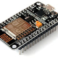 NodeMCU V2 Lua WiFi IOT Development Board ESP 12E ESP8266 - a black rectangular circuit board with a micro-USB port, two buttons, and pin headers.