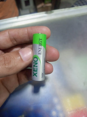 Non Rechargeable Xeno Energy XL-060H AA 3.6V Primary Lithium Battery - a green and silver cylindrical battery with Xeno Energy branding.