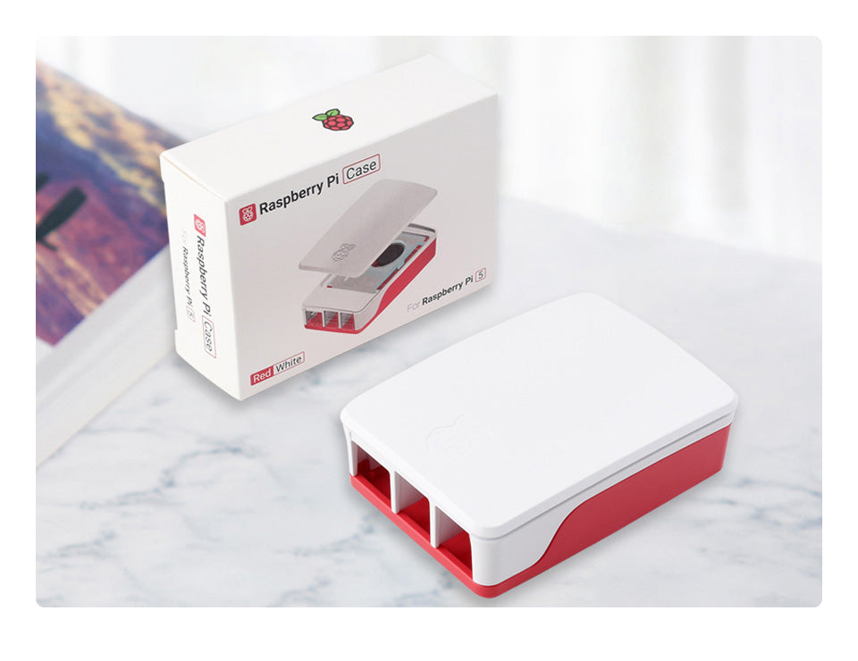 Official Raspberry Pi Case for Raspberry Pi 5, Built-in Cooling Fan, Red/White Color - the red and white assembled case next to its white retail packaging box.