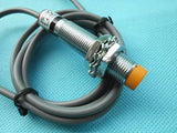 Omron Inductive Proximity Sensor Switch E2e-X2E1 - a cylindrical metal sensor with an orange tip, two mounting nuts, and an attached grey cable.