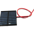 On Demand 4V 5V 5.5V Solar Panels – DIY Battery Cell Phone Charger | Digilog.pk - a rectangular black solar panel with a blue grid pattern and two attached red and black wires.