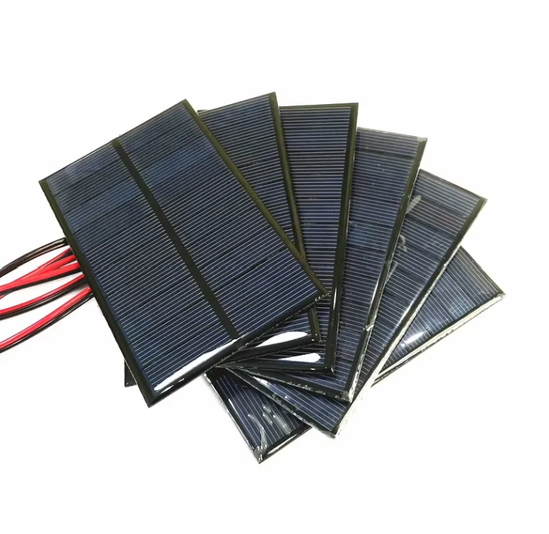 On Demand 4V 5V 5.5V Solar Panels – DIY Battery Cell Phone Charger | Digilog.pk - show a stack of rectangular, dark blue solar cells with attached red and black electrical wires.