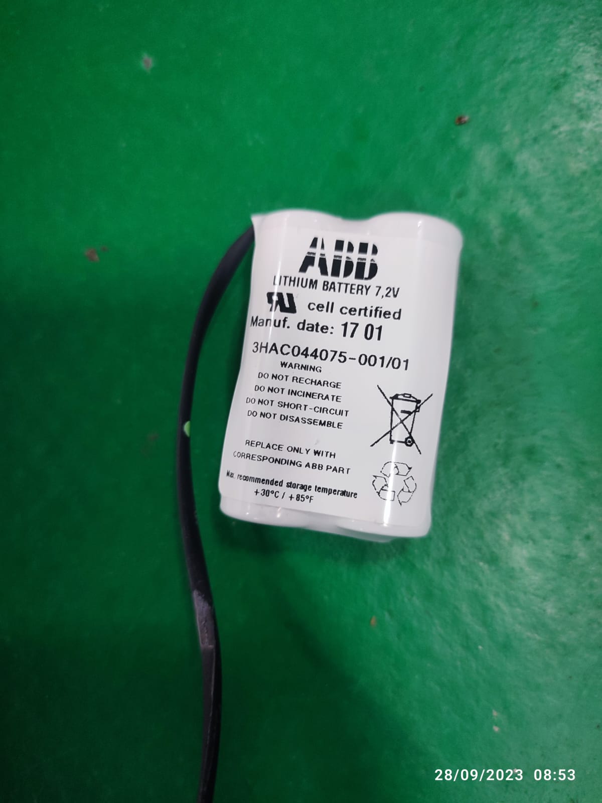 On Demand 7.4V Li Ion Battery For 3HAC044075 Replacement - a white cylindrical battery pack with a black cable, showing printed safety text and labels.