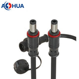 ON DEMAND AH-M12-0402MFD01111 AHUA M12 panel type 5521 5525 Male Connector - two black cylindrical male power connectors with red O-rings and a tethered protective cap.