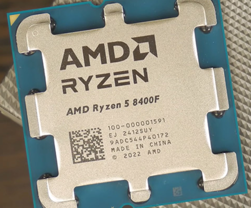 On Demand AMD Ryzen R5 8400F Processor 6 cores and 12 threads - a close-up view of the square metal integrated heat spreader with the brand name and model number laser-etched on top.