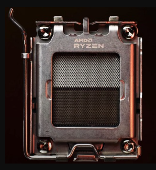 On Demand AMD Ryzen R5 9600X Processor 6 cores and 12 threads - a close-up view of the metallic CPU integrated heat spreader with the AMD Ryzen logo etched on the top surface.