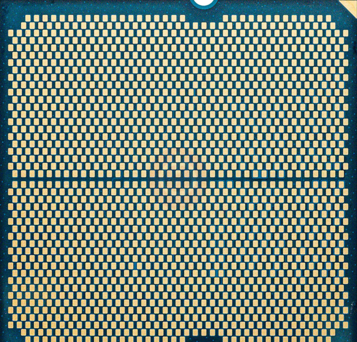 On Demand AMD Ryzen R5 9600X Processor 6 cores and 12 threads - a close-up view of the golden contact pads on the underside of the square CPU chip.