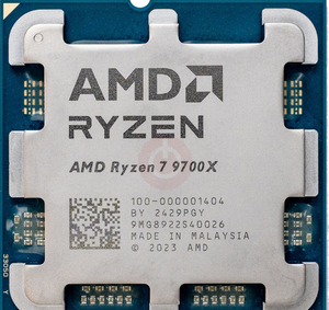 On Demand AMD Ryzen R7 9700X Processor 8 cores and 16 threads - a close-up of the silver metal heat spreader on a blue square circuit board with printed text and serial numbers.