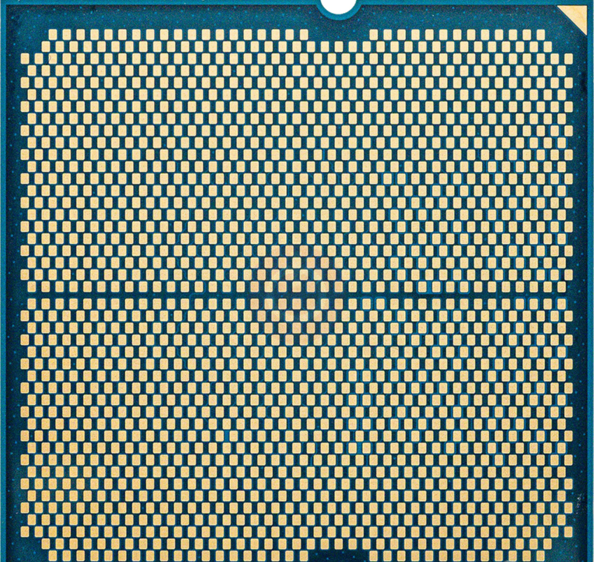 On Demand AMD Ryzen R7 9700X Processor 8 cores and 16 threads - a close-up view of the square blue CPU underside featuring a dense grid of gold-coloured contact pins.