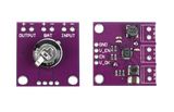 On Demand BQ25570 Energy Harvester Module with Boost Charger and Buck Converter | Digilog.pk - top and bottom views of the purple circuit board featuring a capacitor, inductor, and labeled input/output terminals.