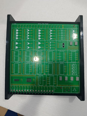 On Demand DLD Trainer Digital Logic Trainer WWW.DIGILOG.PK - a green rectangular board with logic gate diagrams, toggle switches, and two seven-segment displays.