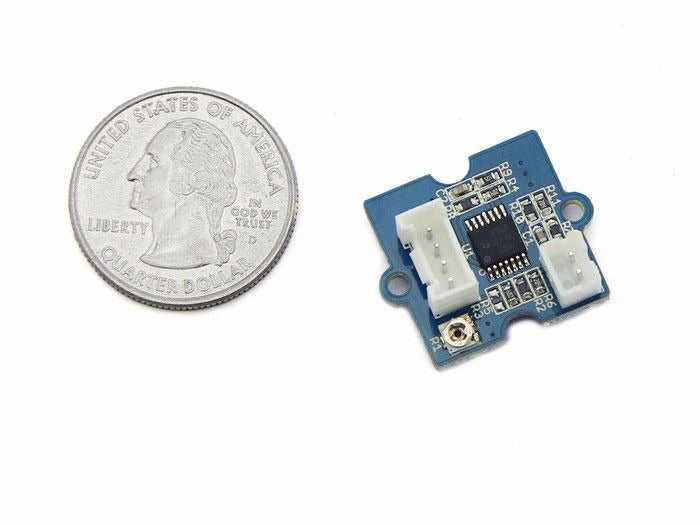 On Demand Grove GSR Sensor - Galvanic Skin Response Sensor - a blue square circuit board with two white connectors and a central microchip, shown next to a US quarter coin for scale.