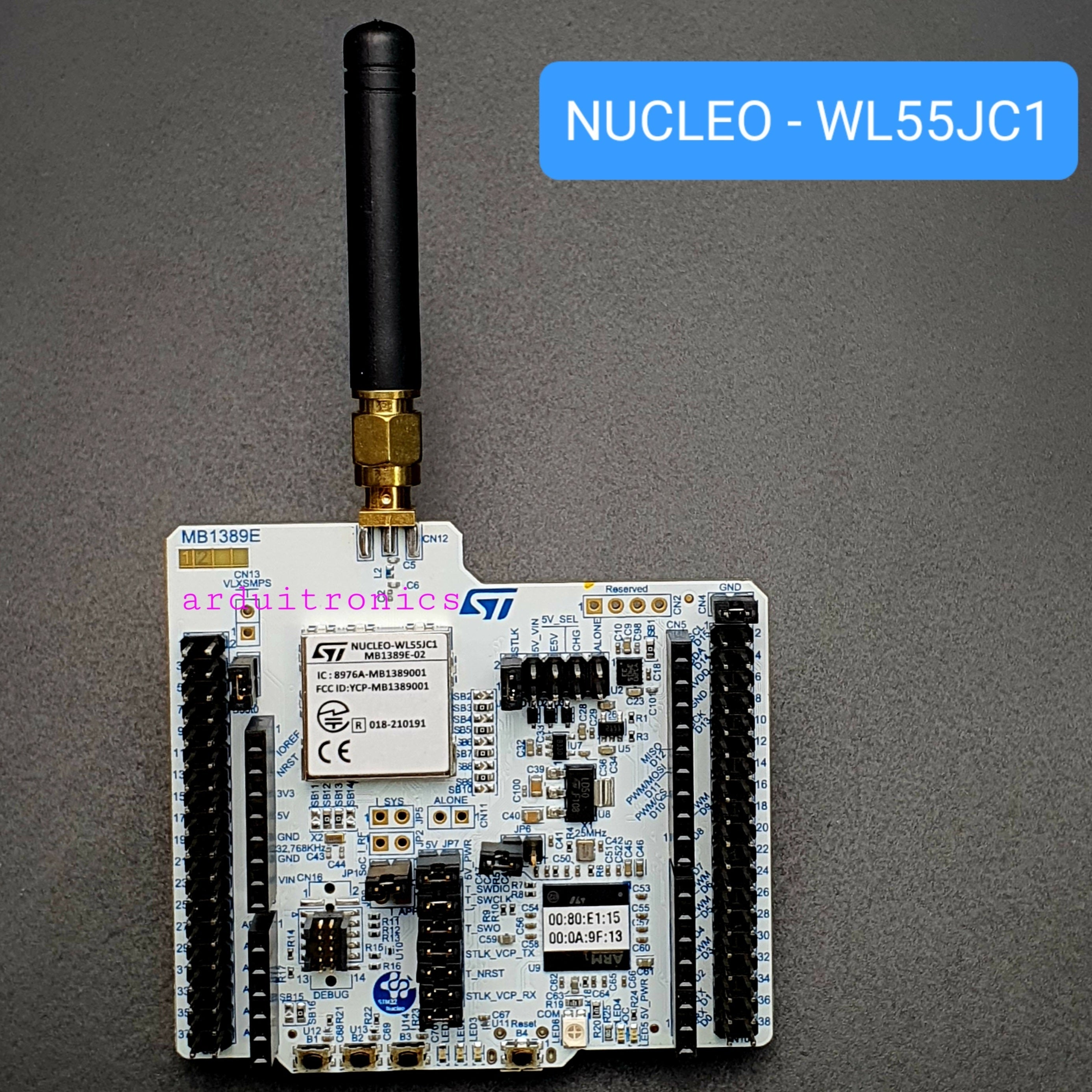 On Demand NUCLEO-WL55JC1 Nucleo-64 Development Board STM32WL55JCI Dual-Core ARM Cortex-M4/M0+ (LoRa & Sub-GHz) - with a black antenna attached, featuring a white PCB, dual pin headers, a metal radio module, and onboard buttons.