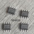 On Demand SD4938 PWM Controller IC 150V MOSFET Current Mode (SMPS Power Supply IC) MOQ IS 100PCS - four black eight-pin integrated circuit chips arranged in a square formation on a grey textured surface.