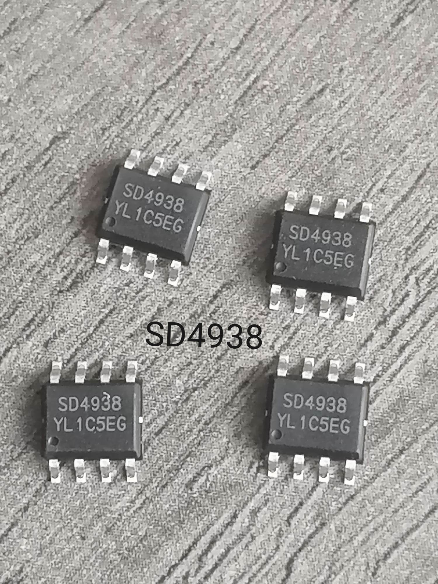 On Demand SD4938 PWM Controller IC 150V MOSFET Current Mode (SMPS Power Supply IC) MOQ IS 100PCS - four black eight-pin integrated circuit chips arranged in a square formation on a grey textured surface.